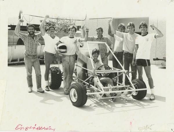 Photograph of engineering students posing with their construction.