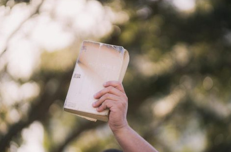Held up bible