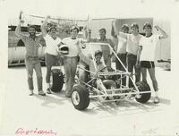 Photograph of engineering students posing with their construction.
