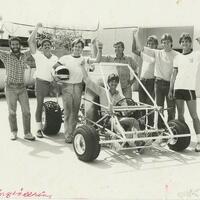 Photograph of engineering students posing with their construction.